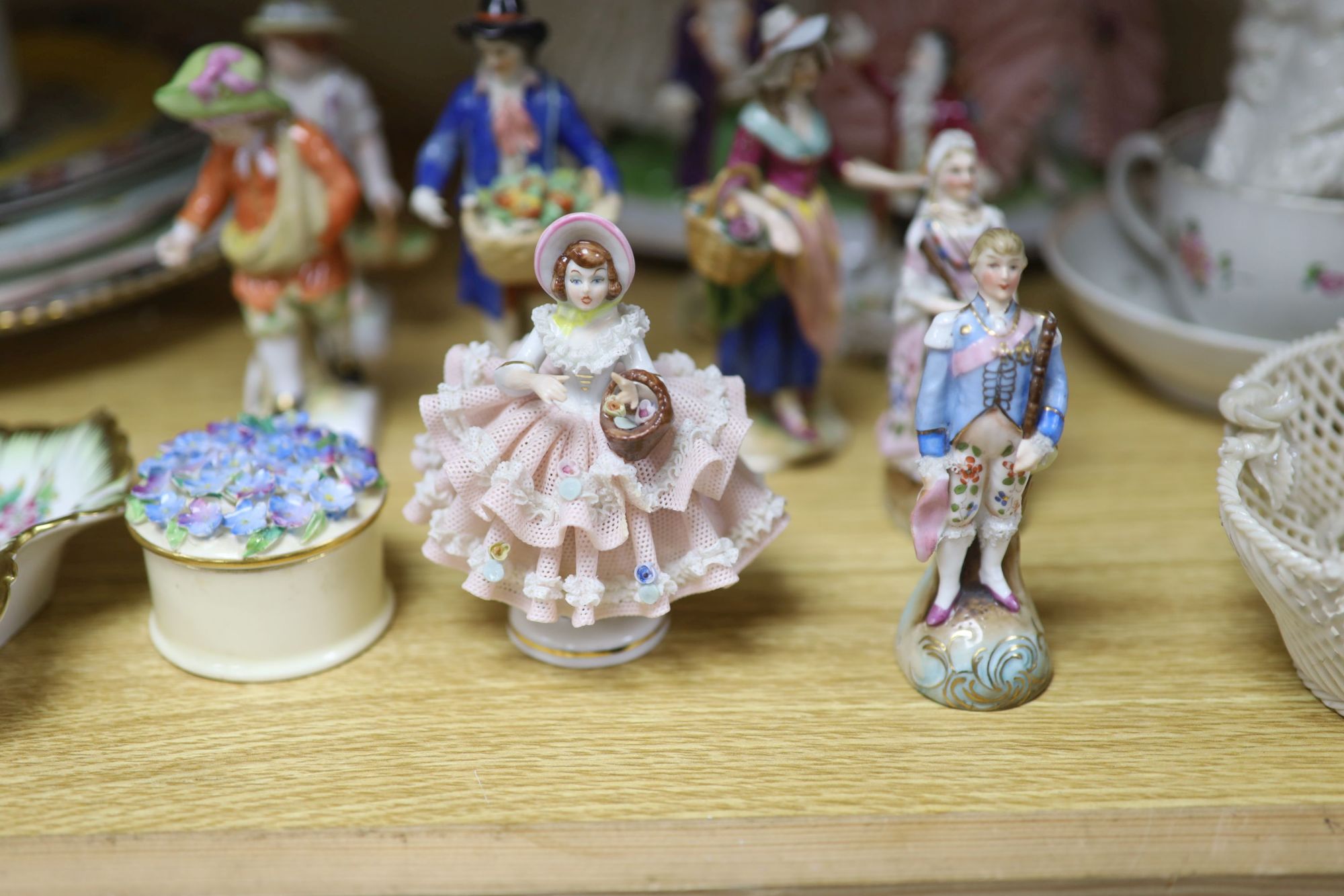 A group of Continental porcelain figures and groups, largest 20cm high and various plates, dishes etc.